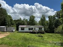 A single-Gathering home featuring a porch and spacious front yard at 118 Burnside Ct, Clover, SC 29710