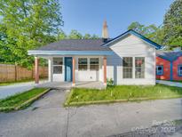 Charming single-story home featuring a cozy porch and freshly painted exterior with great curb appeal at 123 Oak St, Chester, SC 29706