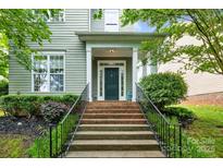 Charming home with a welcoming front entrance and well-maintained landscaping at 132 E Morehouse Ave, Mooresville, NC 28117