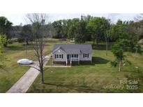Charming one-story home with well-maintained lawn and inviting front porch at 1928 Londonberry Dr, Rock Hill, SC 29730