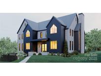 Striking two-story home with modern architecture, elegant brick, dark cladding, and beautiful lawn at 866 Concord Rd # 1C, Davidson, NC 28036