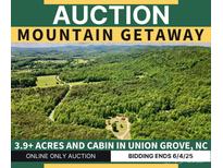 Mountain getaway auction featuring 3.9+ acres and a cabin in Union Grove, NC at 362 Sandburg Rd, Union Grove, NC 28689