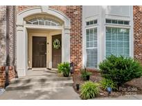 Welcoming brick home with double doors, decorative wreath, and manicured landscaping at 1530 S Church St # K, Charlotte, NC 28203