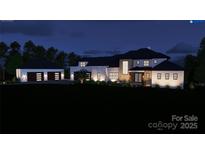 Stunning two-story home featuring a modern design and an attached three-car garage at 268 Hermance Ln, Mooresville, NC 28117