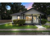 Charming bungalow with black and white trim, inviting porch, and manicured landscaping at 418 Link St, Fort Mill, SC 29715