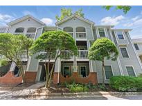 Charming condo with brick facade and a private balcony and manicured front yard at 430 Queens Rd # 332, Charlotte, NC 28207