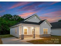 Charming single-story home with a cozy front porch, perfect for enjoying sunsets at 102 W Georgia Ave, Bessemer City, NC 28016