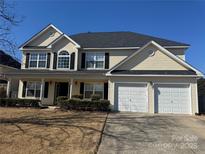 Charming two-story home features a two-car garage, well-manicured front yard, and classic architectural details at 170 Glenn Allen Rd, Mooresville, NC 28115