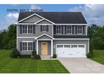Charming two-story home with gray siding, blue shutters, covered entryway, and a two-car garage at 217 Basildon St # 1018, Lancaster, SC 29720