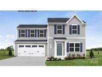 Charming two-story home with gray siding, navy shutters, attached garage, and well-maintained landscaping at 336 Maplestead St # 1080, Lancaster, SC 29720