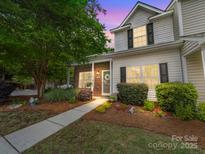 Charming two-story home with landscaped yard, brick accents, and inviting walkway at 3446 Broadwick St, Charlotte, NC 28213