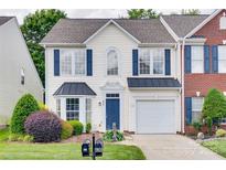 Charming two-story home with blue shutters and a well-manicured lawn and front garden at 622 Bayou Cir, Clover, SC 29710