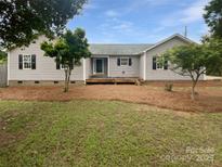 Charming single-story home with a cozy front deck and well-maintained landscaping at 7308 Pleasant Hill Church Rd, Marshville, NC 28103