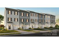 Charming townhomes feature varied siding, private entrances, and attached one-car garages at 11716 Avocet Dr # 75, Charlotte, NC 28215