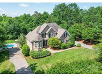 Beautiful brick home with well-manicured lawn and mature trees offers great curb appeal at 1508 Avalon Oaks Ct, Dallas, NC 28034