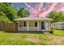 Charming single-story home featuring a covered front porch and a bright blue front door at 485 Lincoln St, Cramerton, NC 28032