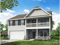 Charming two-story home featuring stone accents, a welcoming porch and a balcony, blending classic style with modern comfort at Lot 003 Bozeman Ct # 3, Stanley, NC 28164
