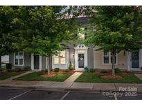 Charming townhome featuring well-manicured landscaping, a welcoming entrance, and inviting curb appeal at 2444 Mariners Cove Ln, Denver, NC 28037