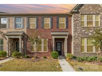 Beautiful brick townhome with a manicured lawn and inviting entryway at 3436 Scottish Fern Ln # 172, Indian Land, SC 29707
