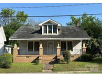 Charming single-Gathering home featuring a covered porch and neat front yard at 462 Dave Lyle Blvd, Rock Hill, SC 29730