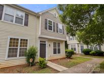 Inviting two-story townhome with neutral siding and a well-maintained front yard at 5529 Seths Dr, Charlotte, NC 28269
