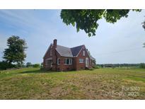 Charming, traditional brick home features a well-maintained lawn and classic architectural details at Tbd Jerusalem Church Rd, Marshville, NC 28103