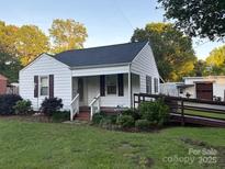Charming single-story home featuring a landscaped front yard and accessible ramp at 1014 Skyway Dr, Kannapolis, NC 28083