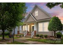 Charming home featuring shingle siding, manicured landscaping, and inviting front porch at 15913 Trenton Place Rd, Huntersville, NC 28078
