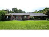 Charming brick home with a well-manicured front yard and mature landscaping at 1922 Salem Church Rd, Lincolnton, NC 28092