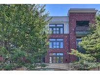 Attractive brick condo building with a balcony and large windows at 2125 Southend Dr # 320, Charlotte, NC 28203
