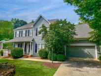 Charming two-story home features a well-manicured lawn and attached two-car garage at 2725 Cotton Planter Ln, Charlotte, NC 28270