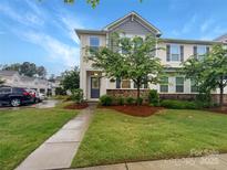 Charming two-story home featuring a manicured lawn and stone accents at 4105 Galloway Park Dr, Charlotte, NC 28262