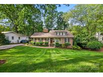 Charming brick home with manicured lawn and landscaping, creating a welcoming curb appeal at 2025 Sagamore Rd, Charlotte, NC 28209