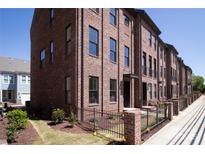 Attractive brick townhomes featuring well-maintained landscaping and a classic architectural design at 226 Gilead Rd, Huntersville, NC 28078