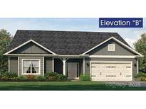 Charming single-story home with gray siding, well-manicured lawn, and attached two-car garage at 230 Mountain Island Dr # 39, Statesville, NC 28677