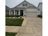 Charming single-Gathering home with a well-maintained lawn, inviting curb appeal, and an attached two car garage at 274 Robinwood Ln, Lake Wylie, SC 29710