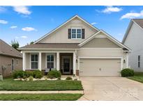 Charming single-Gathering home with a well-manicured lawn and a two-car garage, perfect for suburban living at 274 Robinwood Ln, Lake Wylie, SC 29710