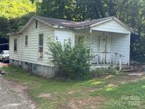 Exterior view of a quaint one-story home with a covered front porch and small yard at 2925 Titman Rd, Gastonia, NC 28054