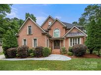 Charming brick home with well-manicured landscaping and inviting front entrance at 310 Ridge Reserve Dr, Clover, SC 29710
