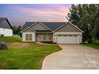 Beautiful single Gathering home featuring a two-car garage, neutral colors, and a landscaped yard with a concrete driveway at 3478 Winters St, Newton, NC 28658