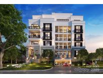 Elegant condo building with balconies, stone accents, and well-maintained landscaping showcasing luxury living at 409 Queens Rd # 202, Charlotte, NC 28207