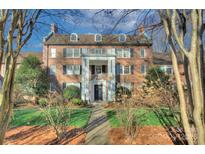 Stately brick building with a prominent entryway and manicured lawn at 101 S Laurel Ave # 72A, Charlotte, NC 28207