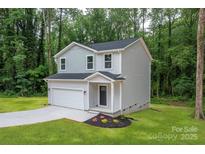 Charming two-story home with attached garage and landscaping at 1941 32Nd Ne St, Hickory, NC 28601