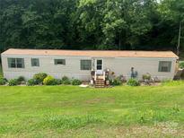 Charming single-story home with landscaped front yard, perfect for relaxing at 2165 Peanuts Ln, Newton, NC 28658