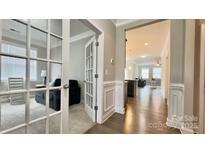 Bright home office featuring french doors, neutral walls, and plush carpet at 3735 Norman View Dr, Sherrills Ford, NC 28673