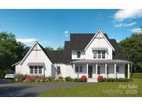 Inviting two-story home with a black shingle roof and an elegant front porch at 4995 Wildlife Ln # 1, Sherrills Ford, NC 28673
