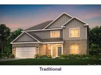 Charming two-story home features a brick facade, a two-car garage, and a manicured lawn at 1350 Coppergate Dr, Salisbury, NC 28147