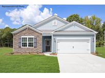 Charming one-story home featuring stone accents, a two-car garage, and a well-maintained front lawn at 150 Parker Claire Ln, Kings Mountain, NC 28086
