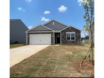 Charming single-story home with a two-car garage and stone accents at 150 Parker Claire Ln, Kings Mountain, NC 28086