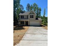 Charming two-story home featuring a long driveway, attached garage, and inviting covered front porch at 183 Pine Haven Rd, Statesville, NC 28677